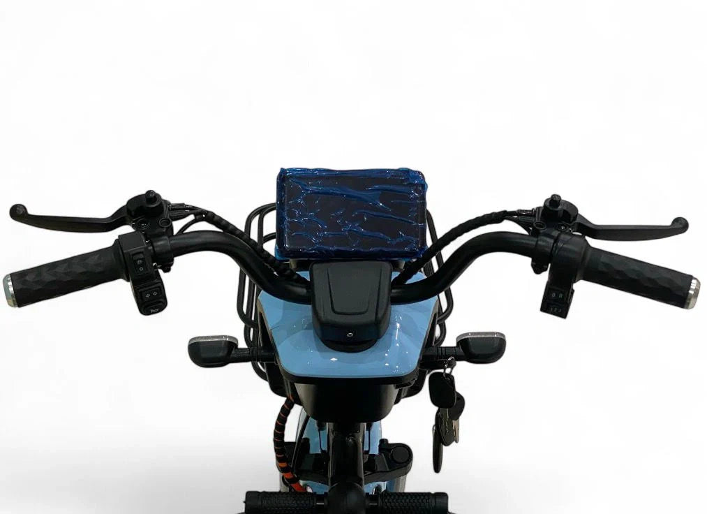 Motorcycle with a blue seat and handlebar bag on a white background