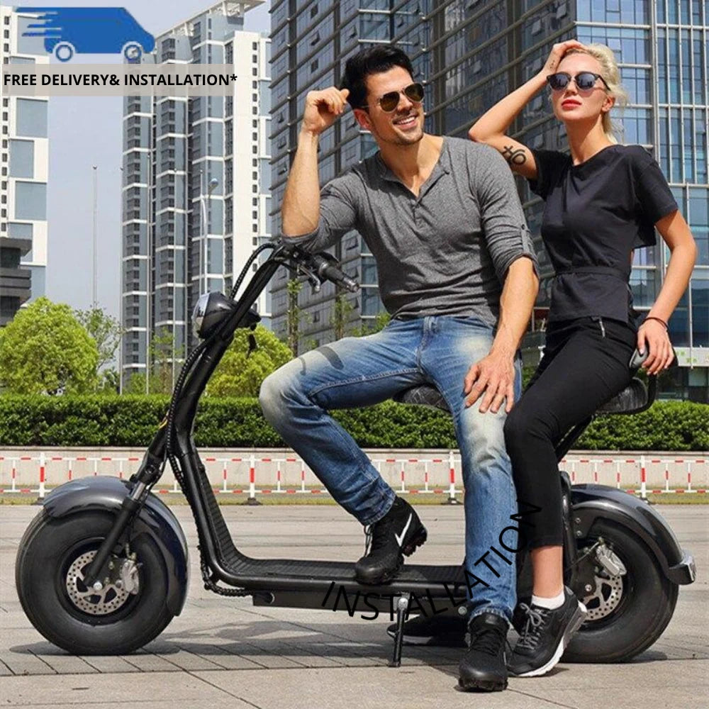 Two people sitting on a black electric scooter with a cityscape background
