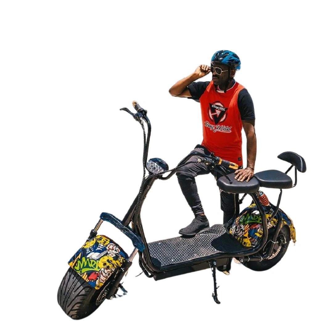 Person sitting on a colorful electric scooter with a white background