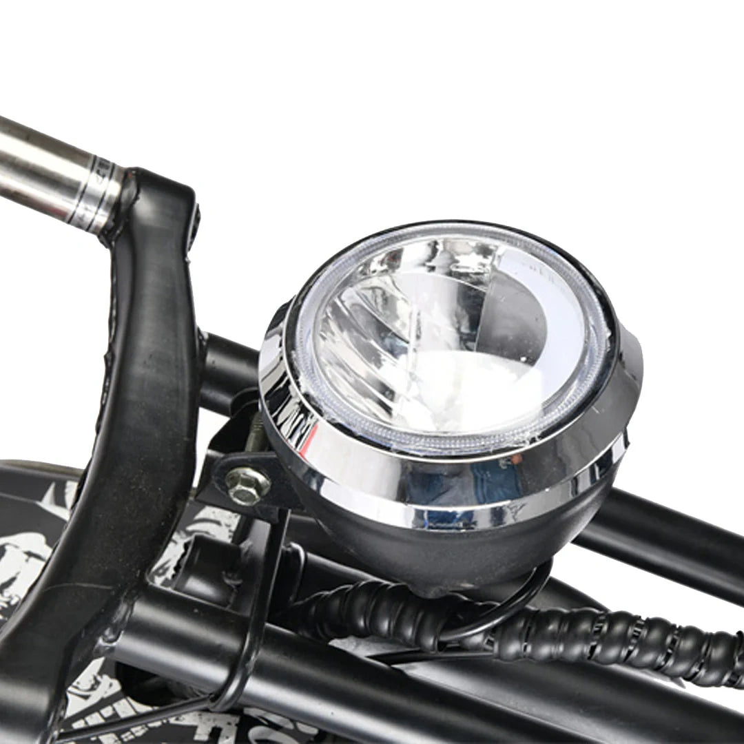 Motorcycle headlight with chrome finish on a white background