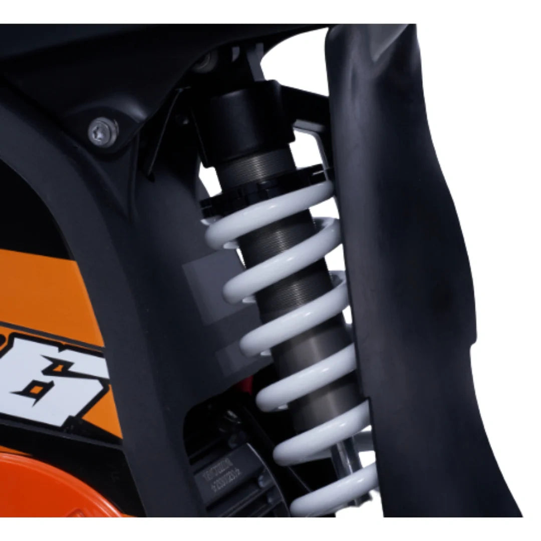 Close-up of a motorcycle suspension system with KTM branding.