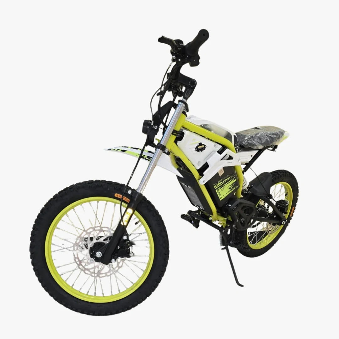 Children's electric bike with green wheels on a white background