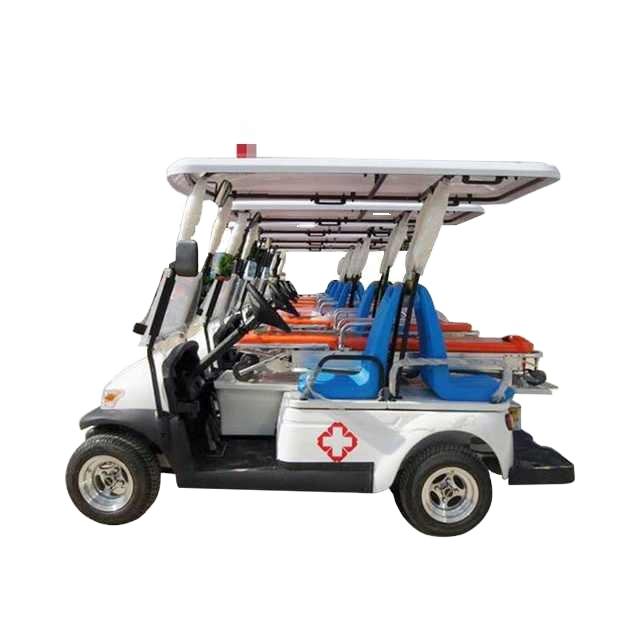ocean cartz side view studio shot showing a line of multiple white electric ambulance golf carts receding into the distance against a white background. This image of medical utility vehicles in stock highlights the specialized rear section equipped with orange stretchers and blue backboards. Each emergency response cart has a red cross logo on the side and a white roof with a small red light.