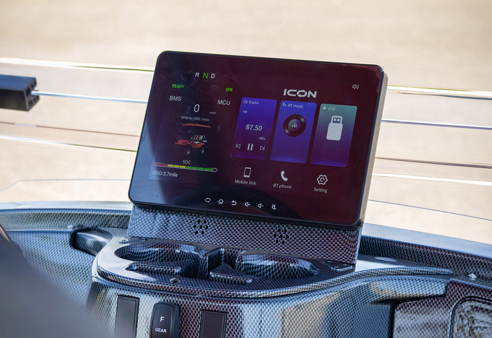 Car dashboard with a digital display showing various icons and information.