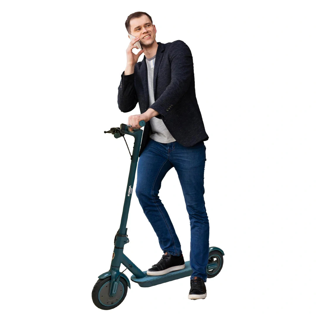 Man standing on a green electric scooter against a white background
