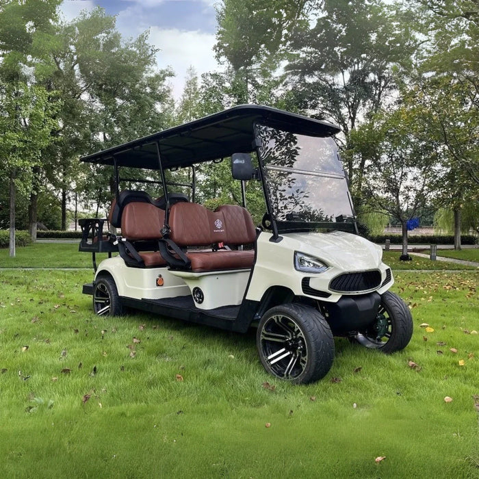 Golf cart on grass with trees in the background