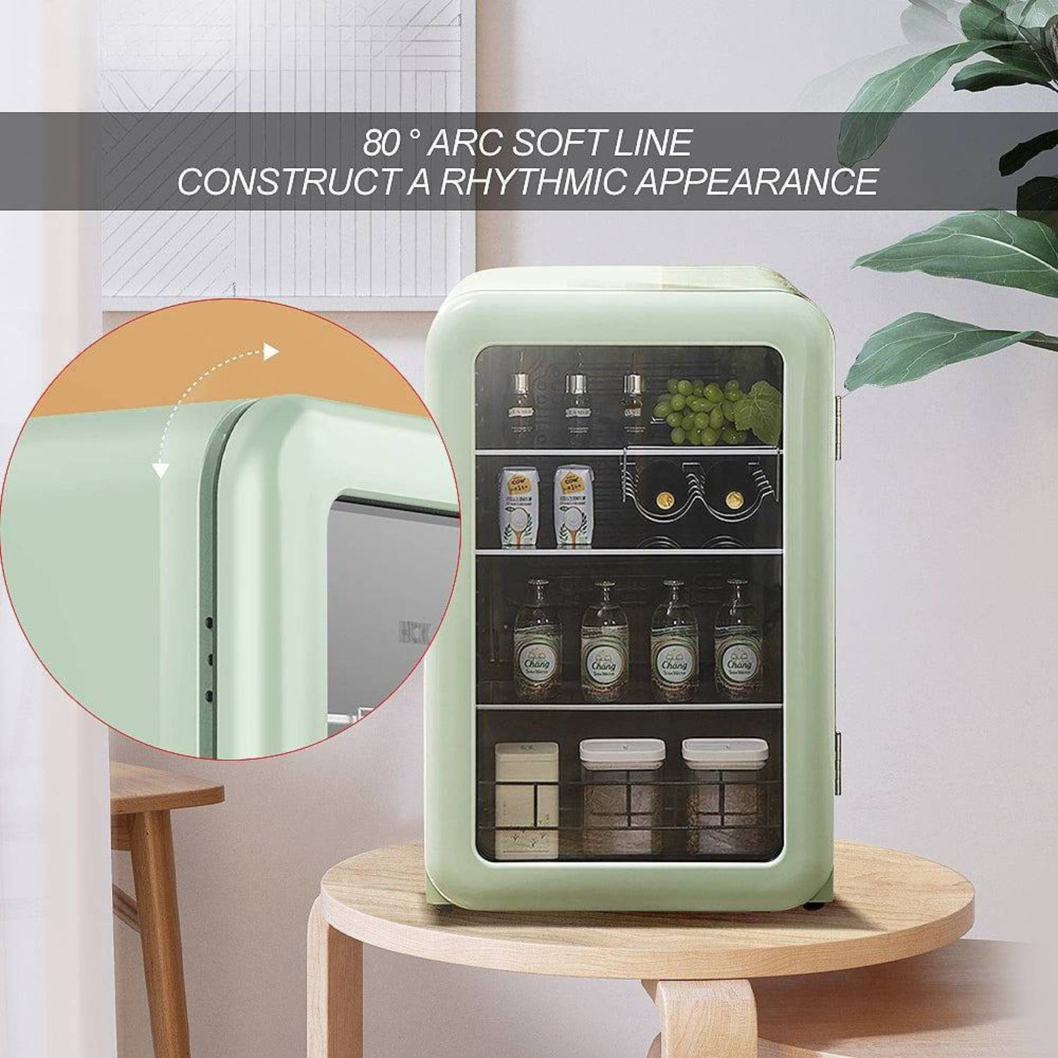 Green mini refrigerator on a wooden stool with a plant in the background