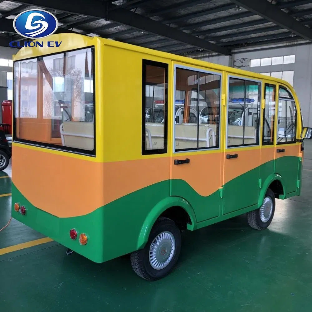 Small electric vehicle with a yellow and green color scheme in a warehouse setting.