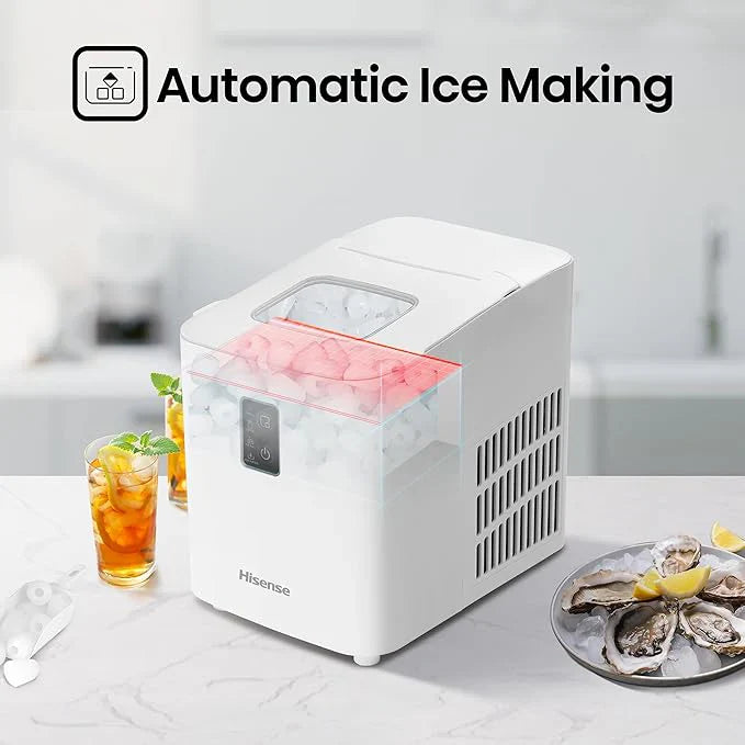 White ice maker with ice cubes on a kitchen counter, surrounded by drinks and food.
