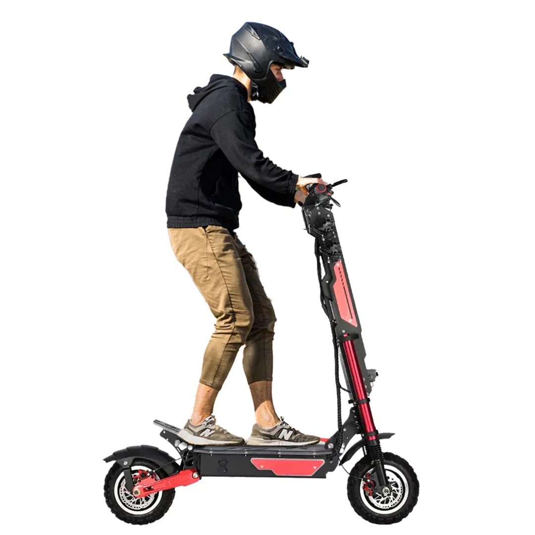 Person riding a black and red electric scooter on a white background