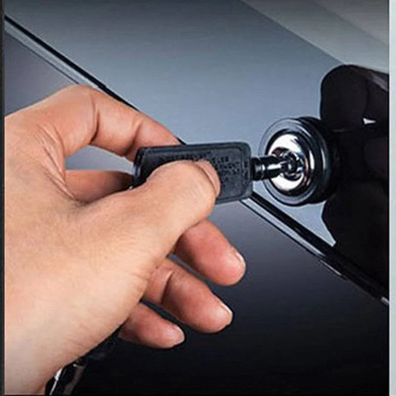 Hand inserting a key into a car ignition