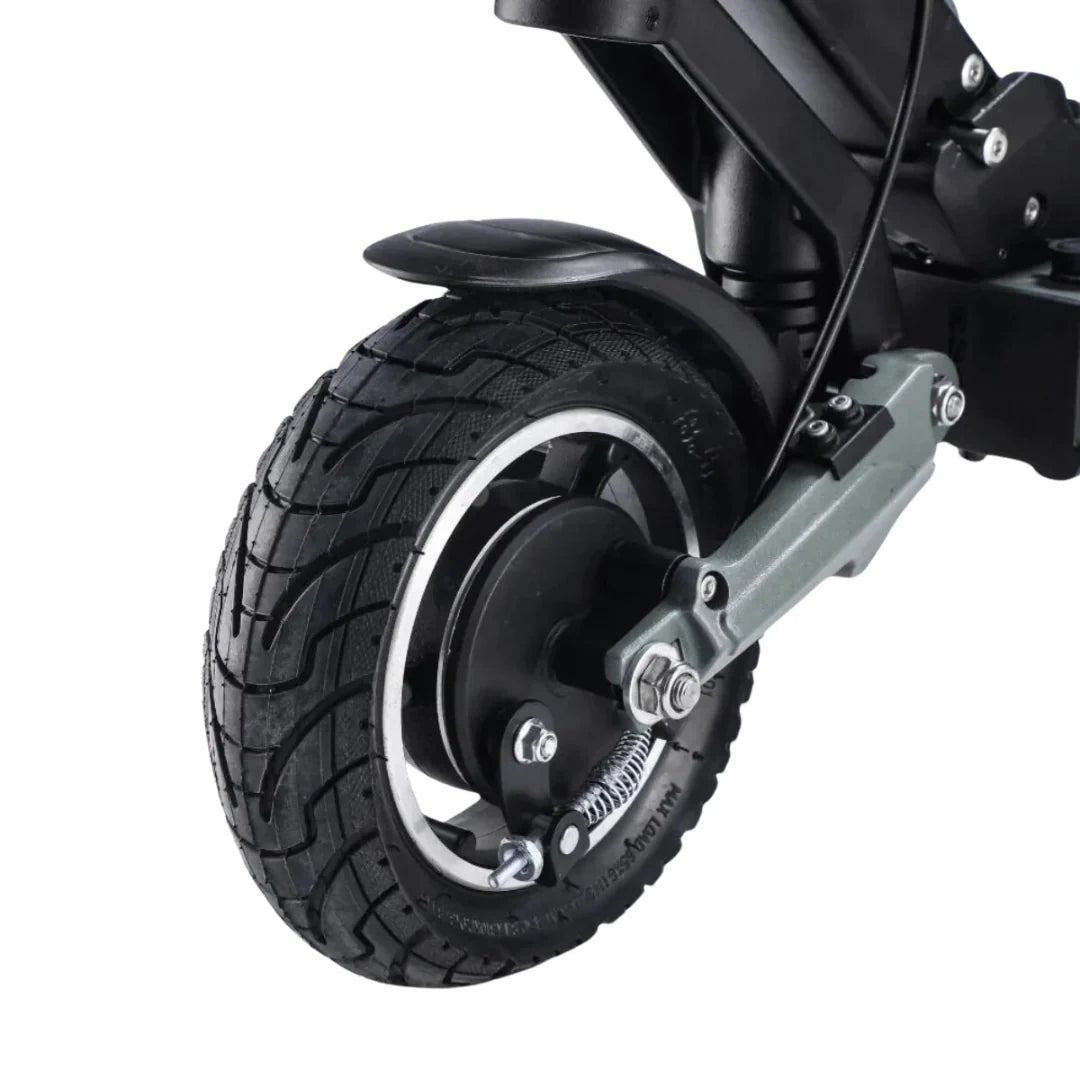 Close-up of a scooter wheel with tire on a white background