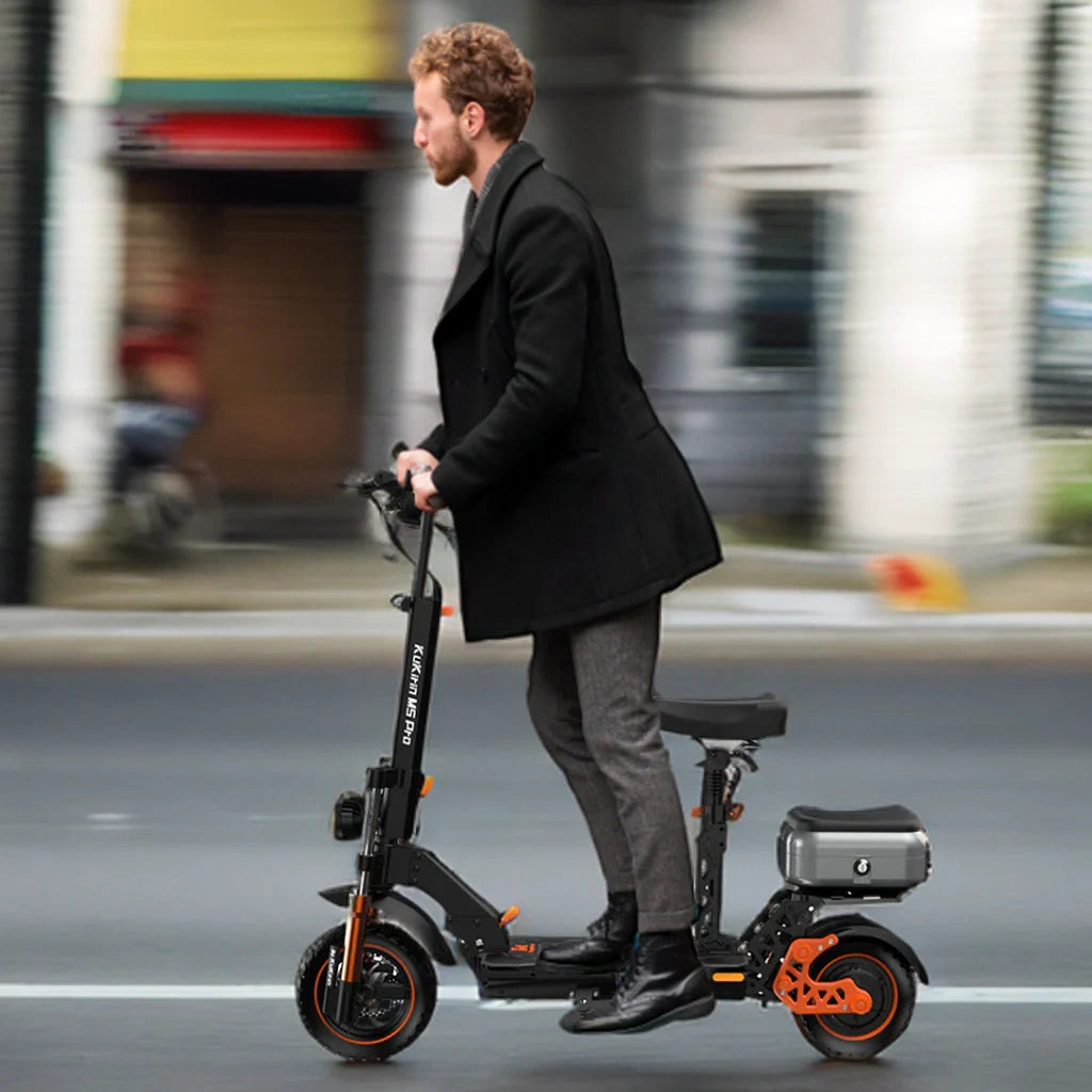 Man riding a black electric scooter with orange accents on a city street.