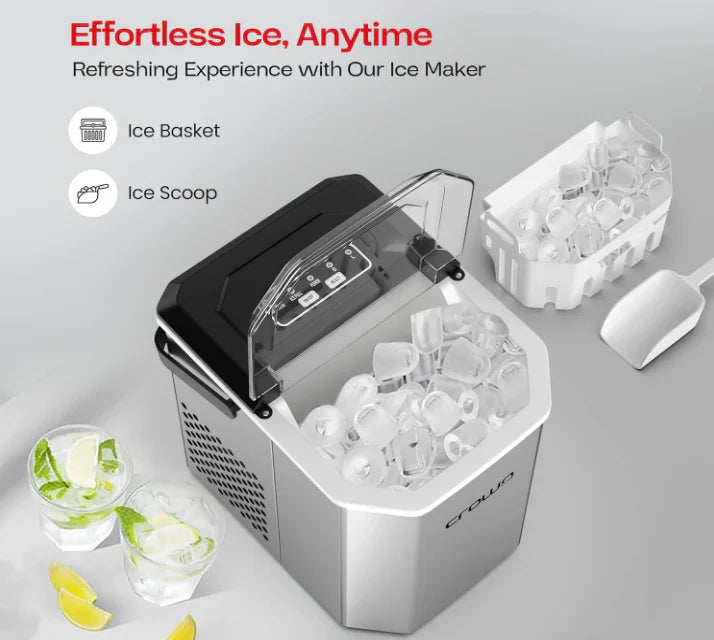 Ice maker with ice cubes, glasses, and lemon slices on a gray background