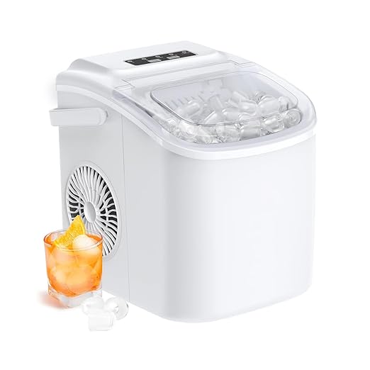 White portable ice maker with a glass of orange drink on a white background