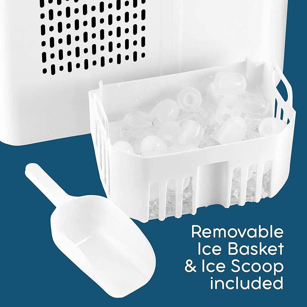 White ice maker with removable ice basket and ice scoop on a blue background
