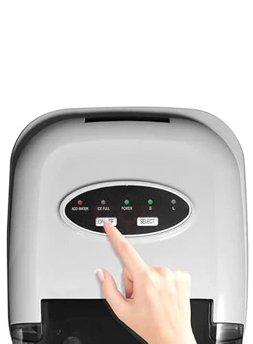 Hand pressing a button on an ice maker with a white background