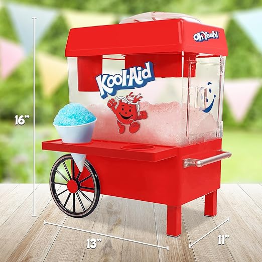 Red Kool-Aid slushy maker with a bowl of slushie on a wooden surface.