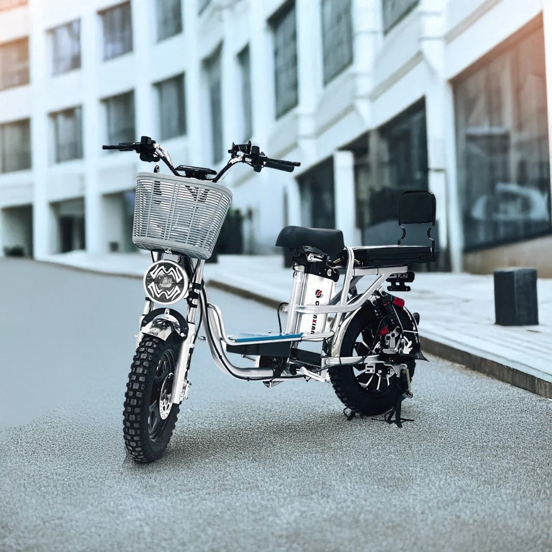 Electric bike on a city street with modern buildings in the background