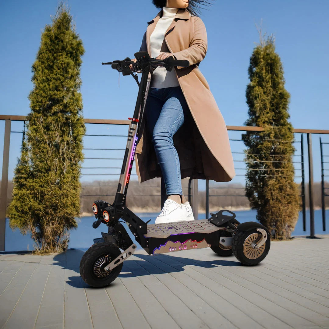 Person riding an electric scooter on a wooden deck with trees and clear sky in the background