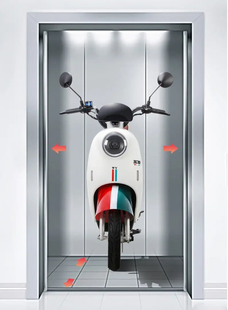 Motorcycle inside a modern elevator with reflective walls.
