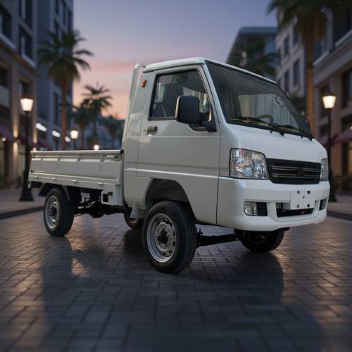 White truck on a city street with palm trees and buildings in the background