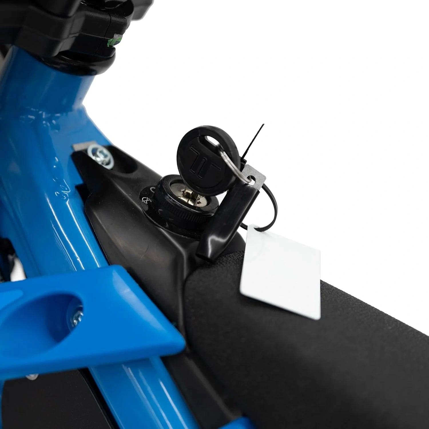 Close-up of a blue and black scooter with a white label on a white background