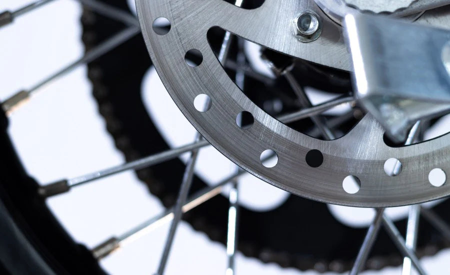 Close-up of a motorcycle wheel with a focus on the disc brake.