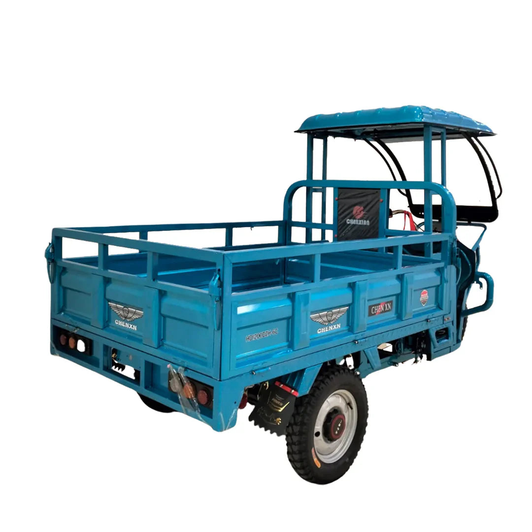 Blue three-wheeled vehicle with a cargo bed on a white background