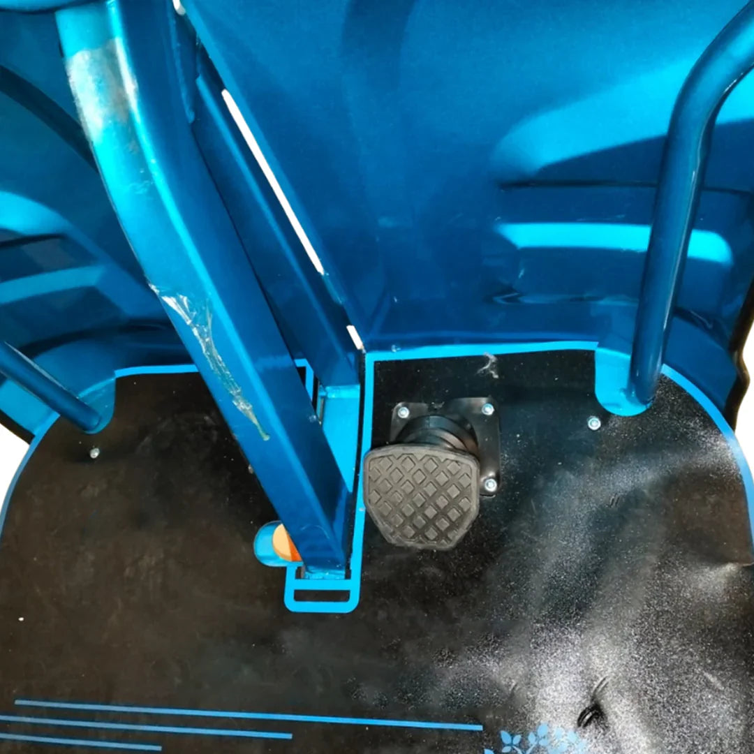Close-up of a blue metal chair with a footrest on a black surface