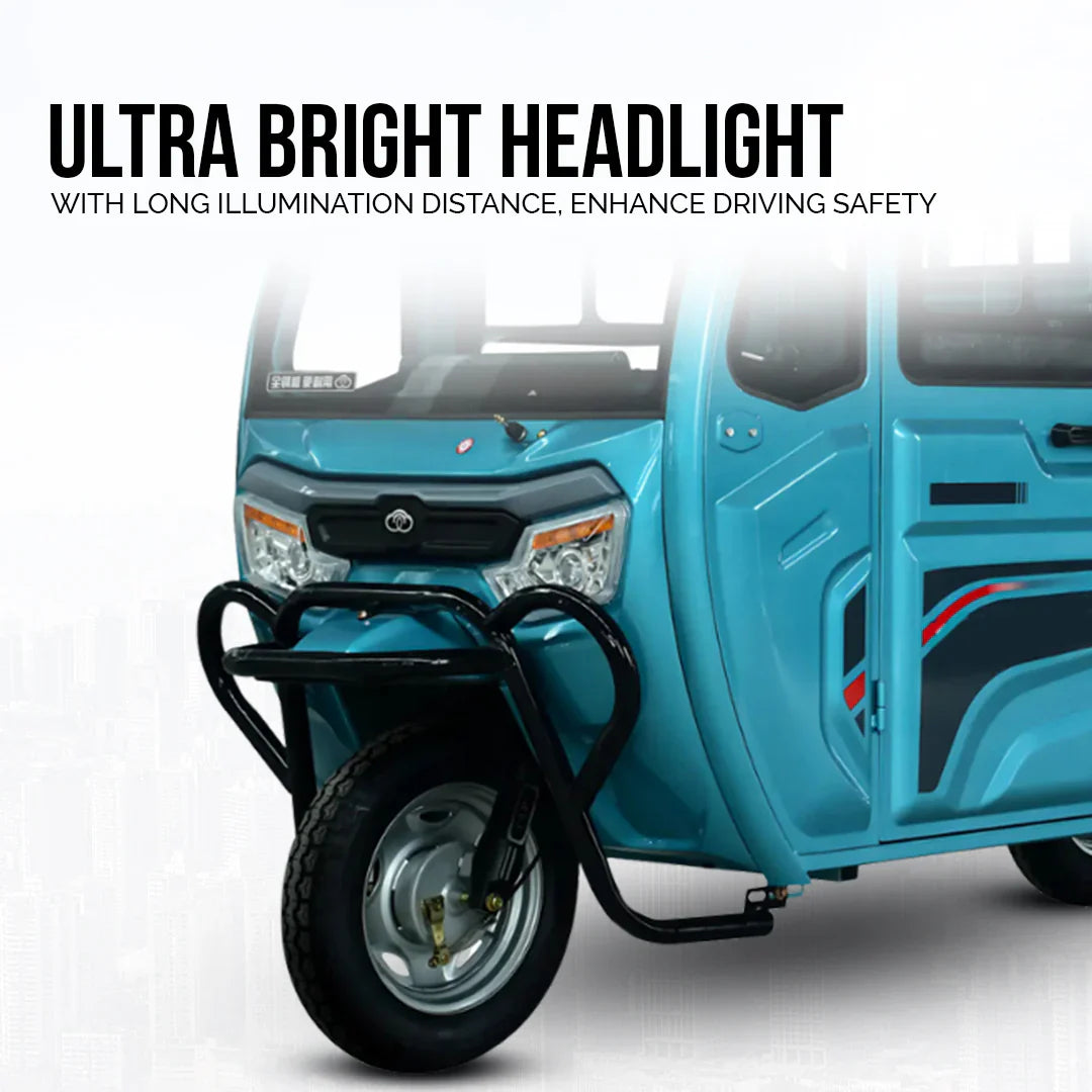 Blue three-wheeled vehicle with ultra bright headlight feature on a white background