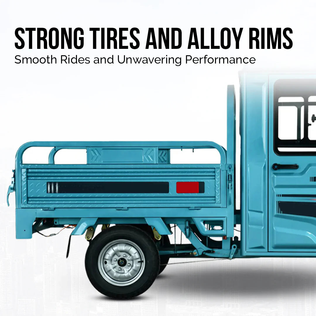 Blue truck with strong tires and alloy rims on a white background