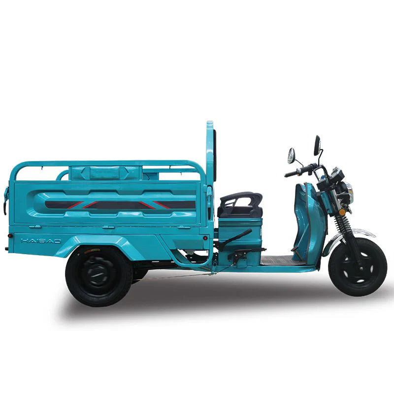 Blue three-wheeled motor vehicle with a cargo bed on a white background
