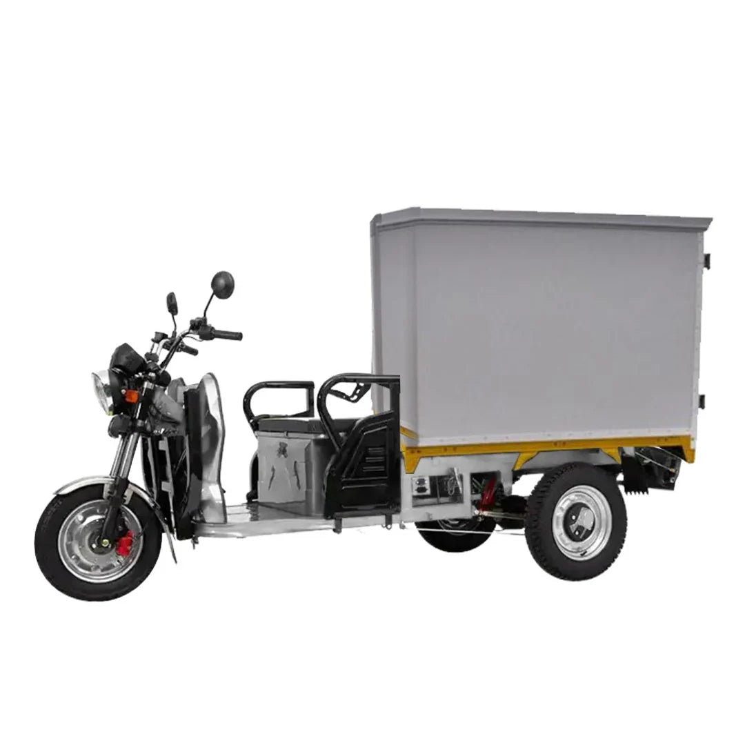 Three-wheeled motor vehicle with a cargo box on a white background