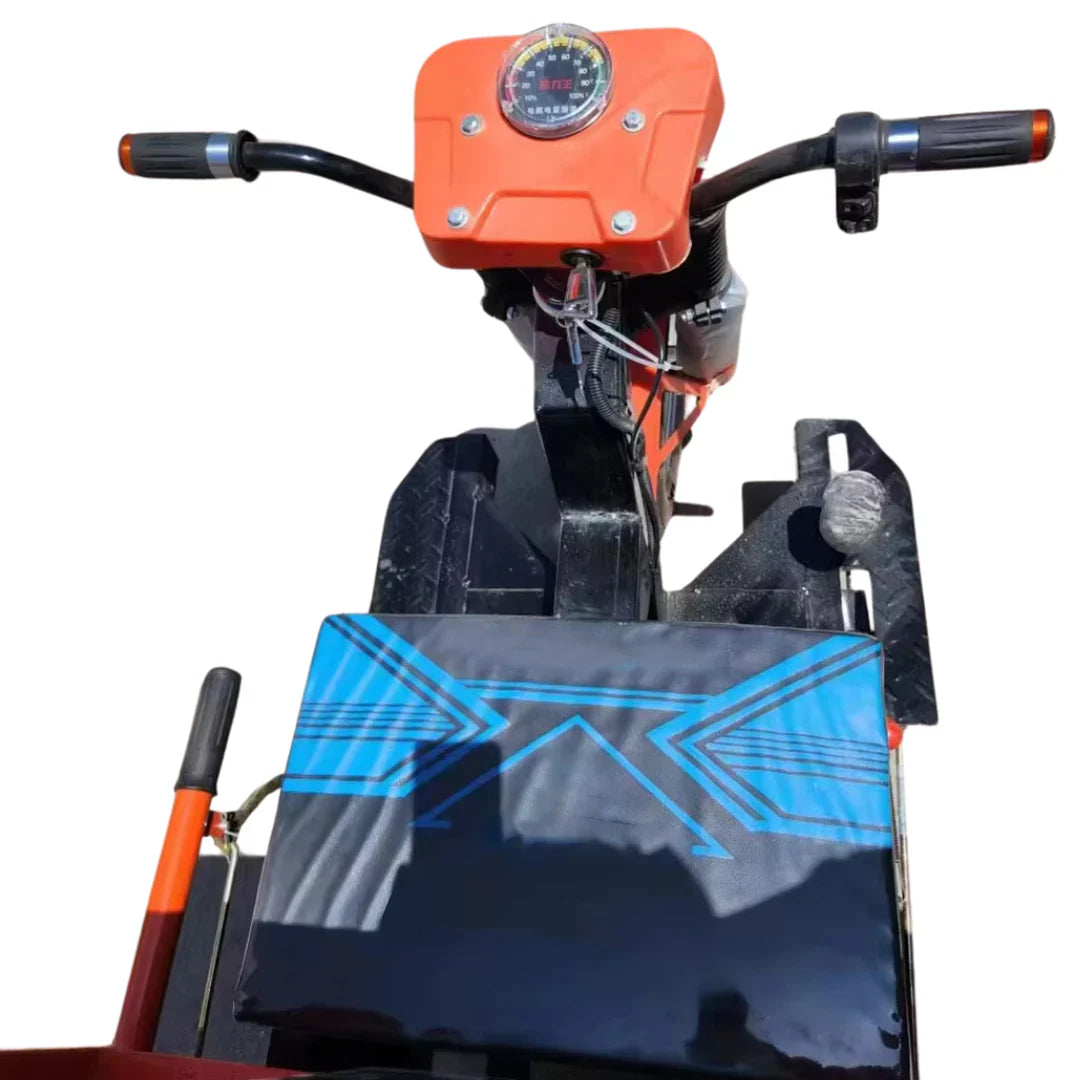 Close-up of a mechanical device with an orange top and black body on a white background