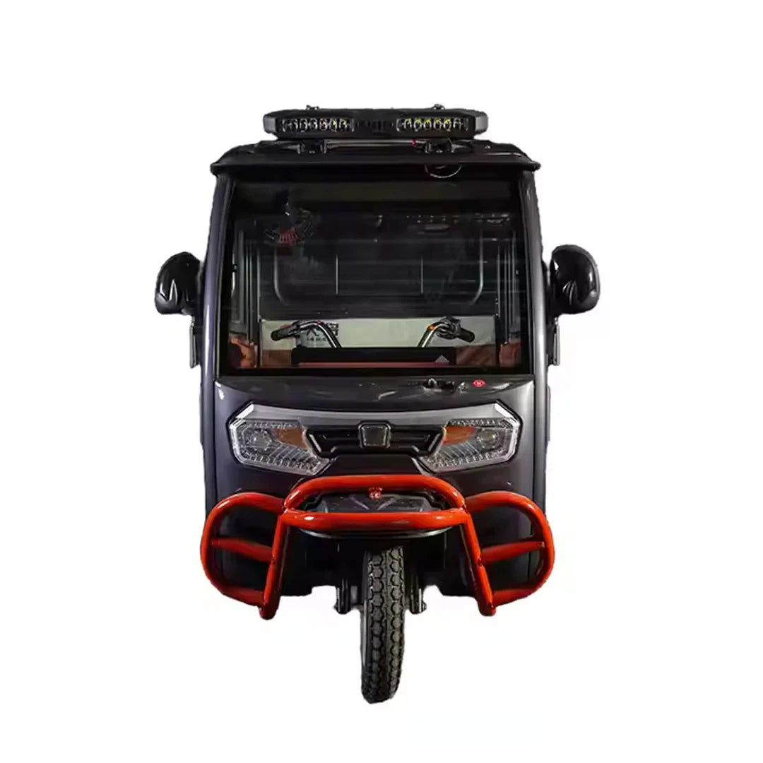 Front view of a small vehicle with a red bumper on a white background