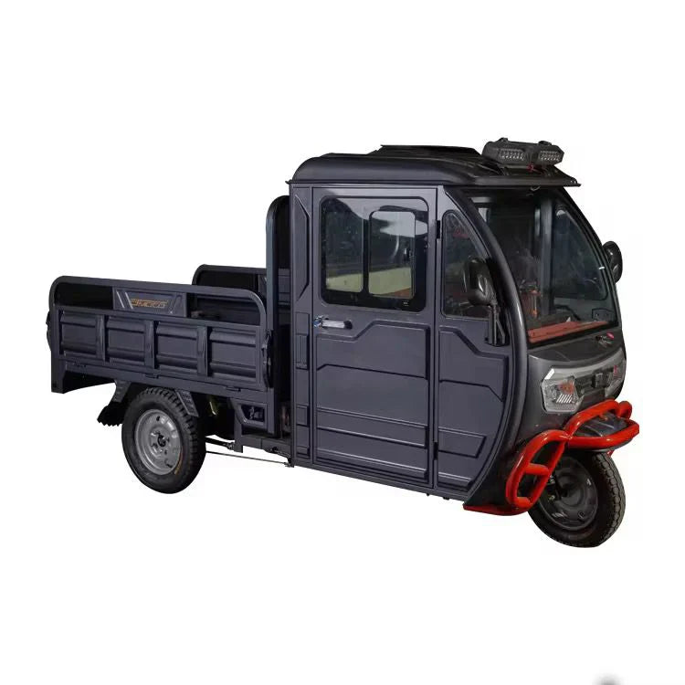 Black three-wheeled vehicle with a cargo bed on a white background