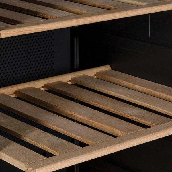 Close-up of a wooden slatted shelf against a dark background