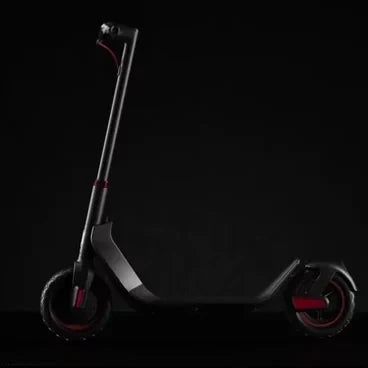 Black scooter with red accents on a black background