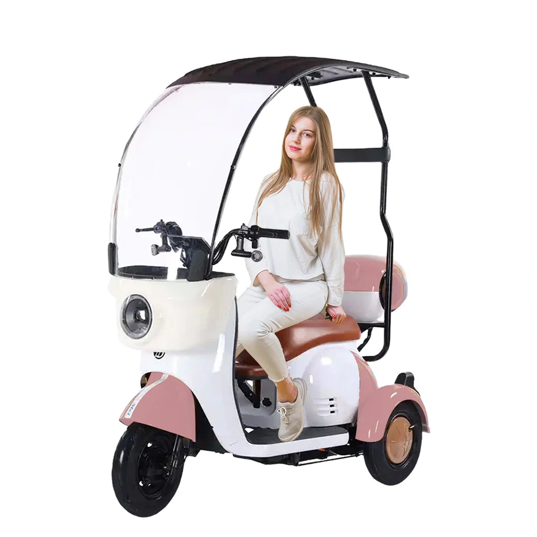 Woman sitting on a pink and white three-wheeled vehicle with a canopy on a white background