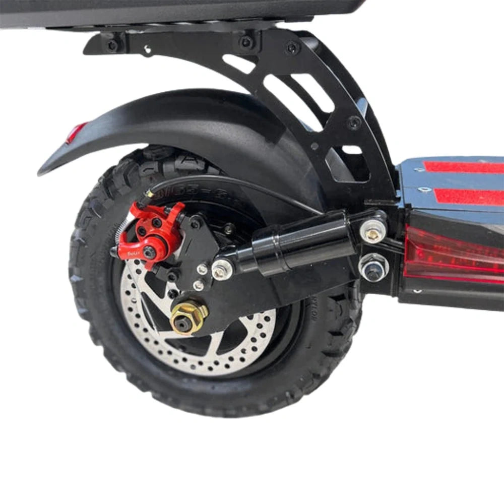 Close-up of a scooter wheel with red brake caliper on a white background