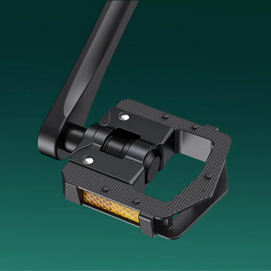Black metal clamp with LED light on a green background