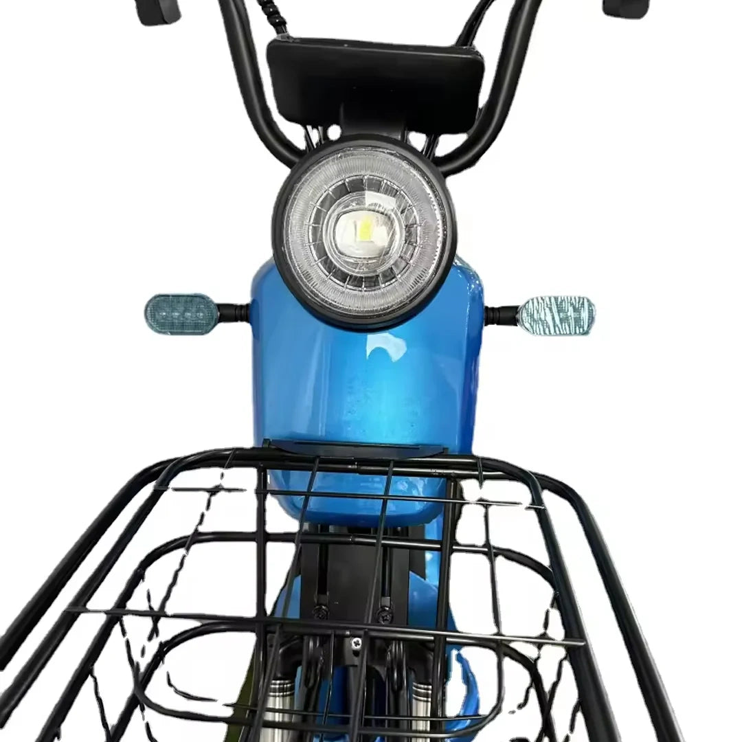 Close-up of a blue electric bike with a front light and basket on a white background