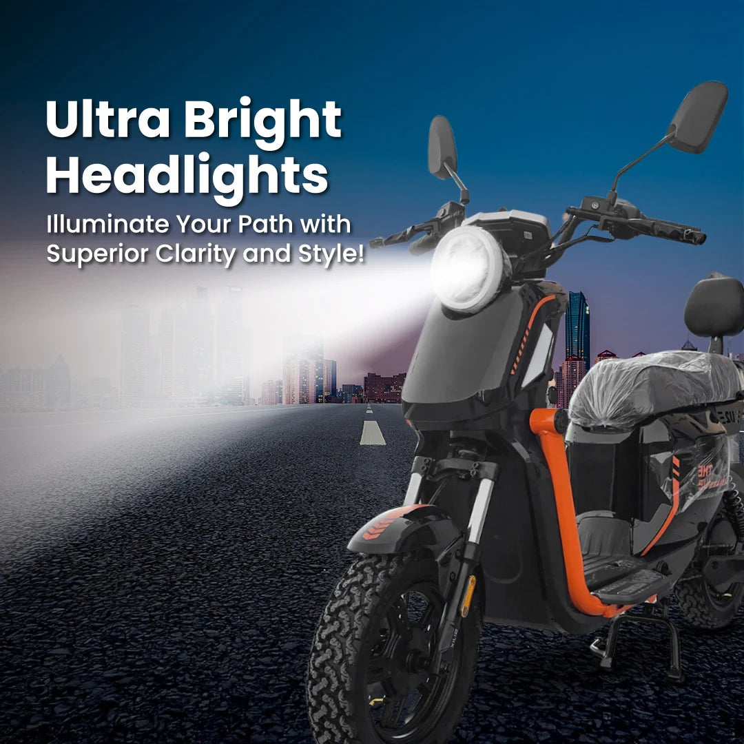 Motorcycle with ultra bright headlights on a road at night, cityscape in the background.