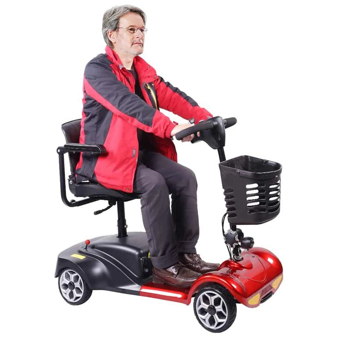 Man sitting on a red and black mobility scooter with a white background
