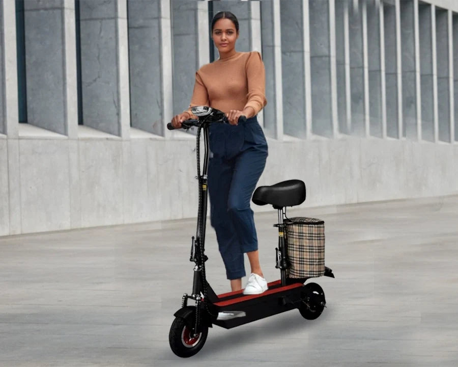 Woman standing next to a black electric scooter with a basket in an urban setting.