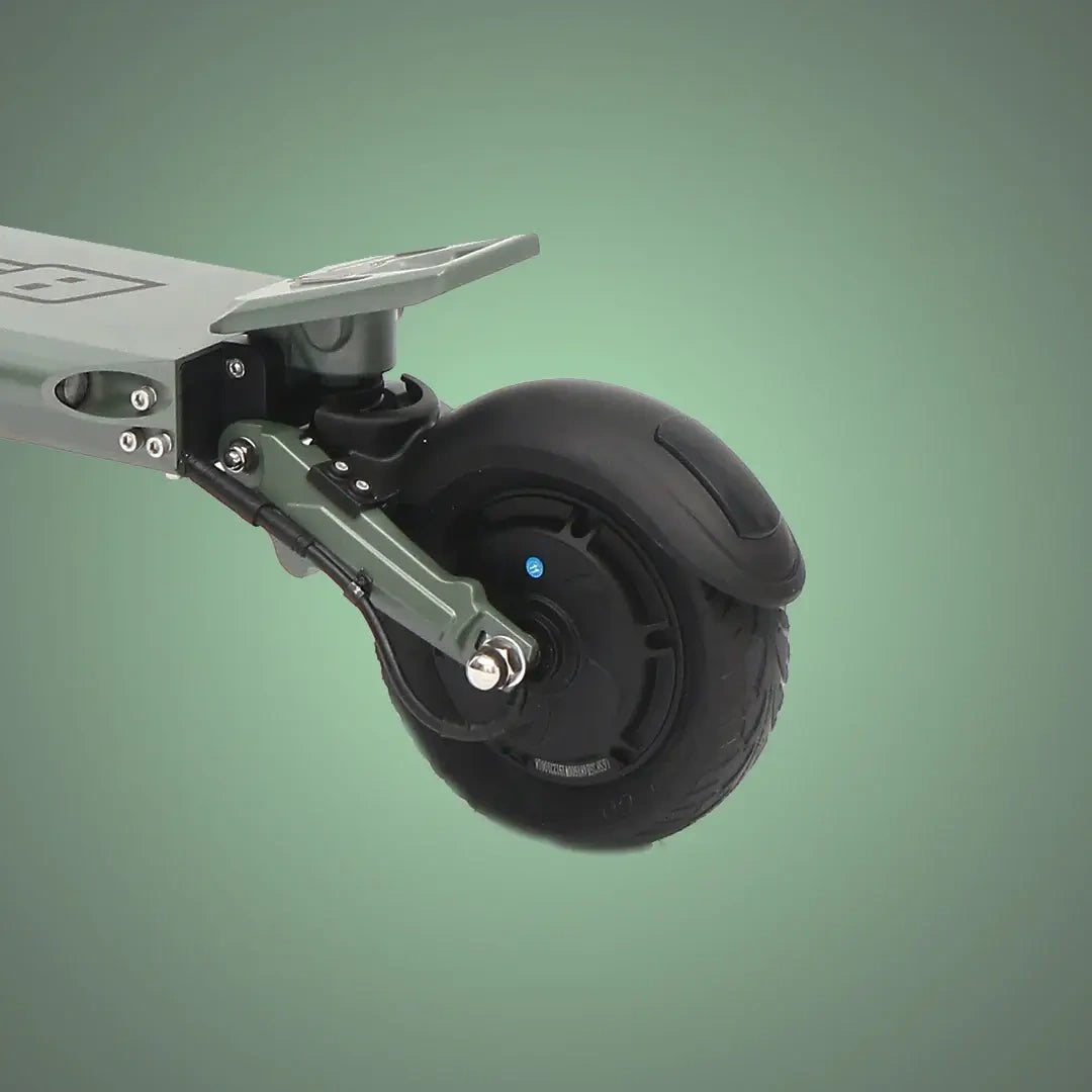 Close-up of a scooter wheel on a green background