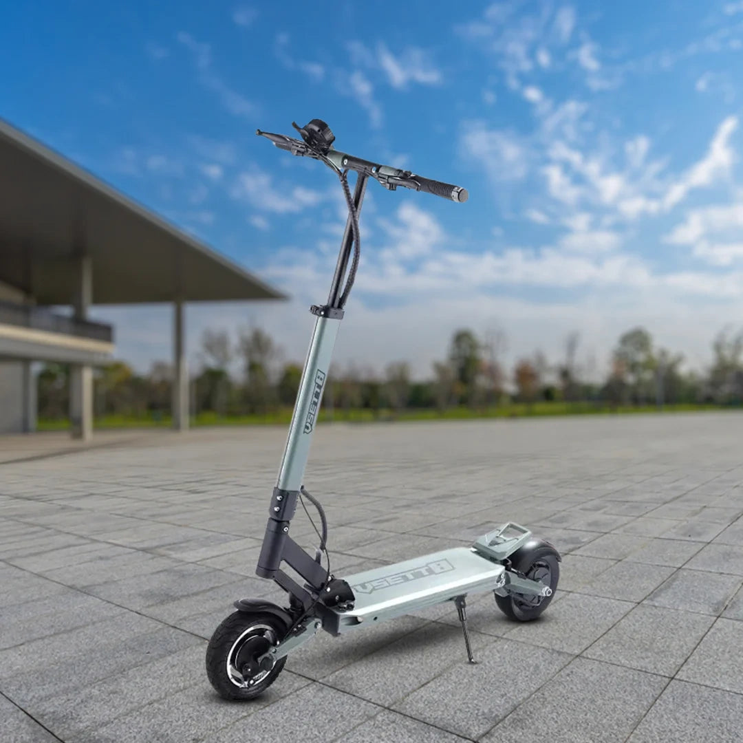 Electric scooter on a paved area with a clear blue sky in the background