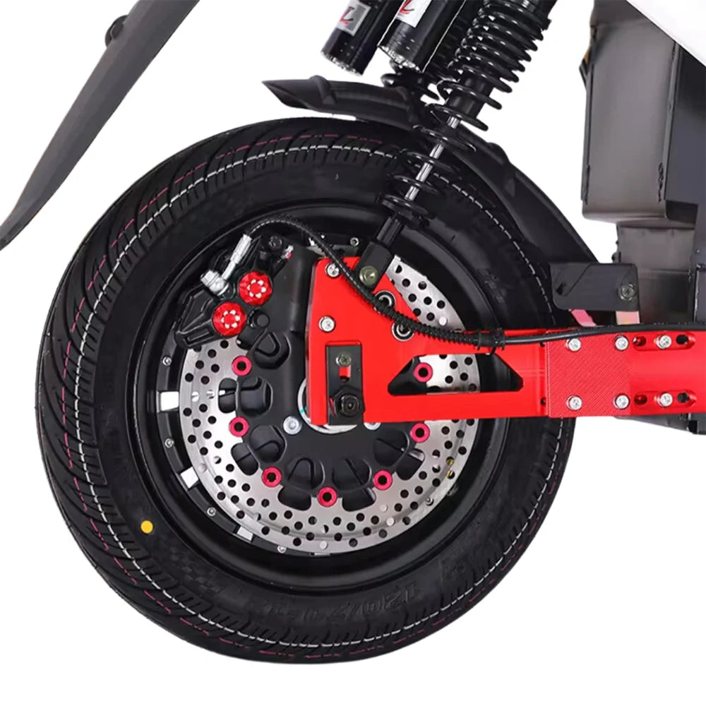 Close-up of a motorcycle wheel with red suspension fork on a white background