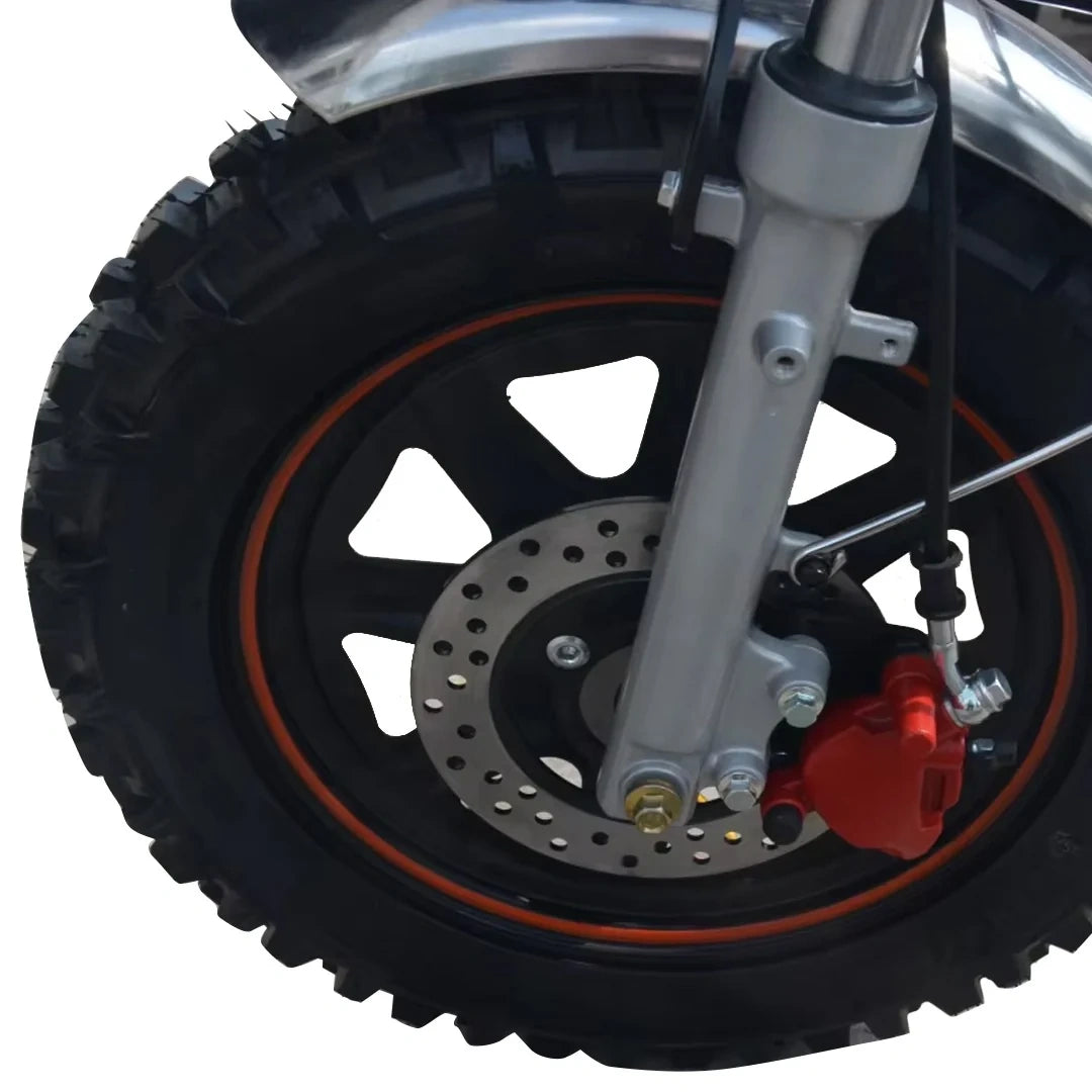 Close-up of a motorcycle wheel with black tire and red rim on a white background